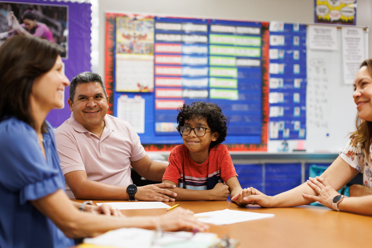 Family meeting with teacher at school